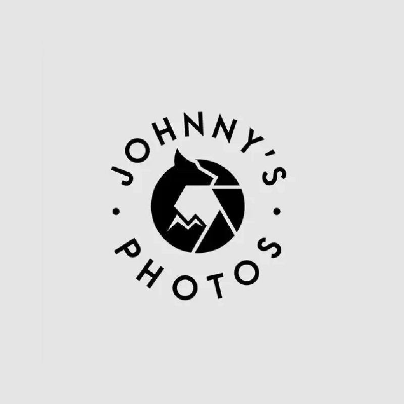 Circular monogram with lens ring for photography brand identity